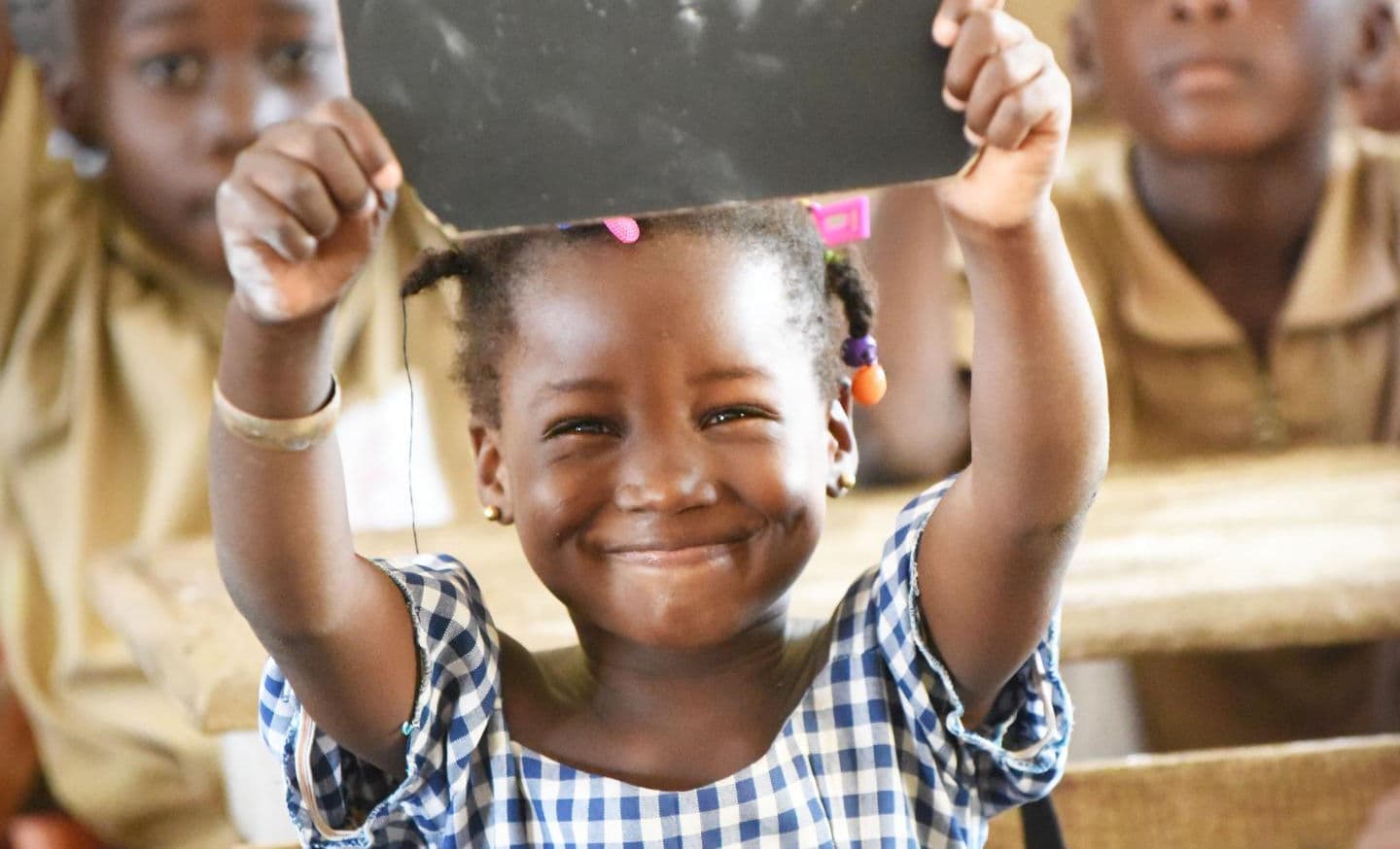 Child smiling in classroom